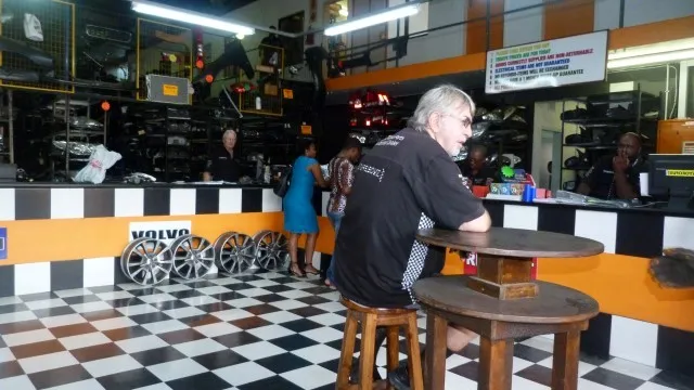 Inside the Sparesboyz showroom with Kia parts on display